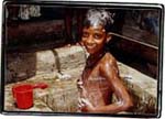 The young lad enjoys his open air bath